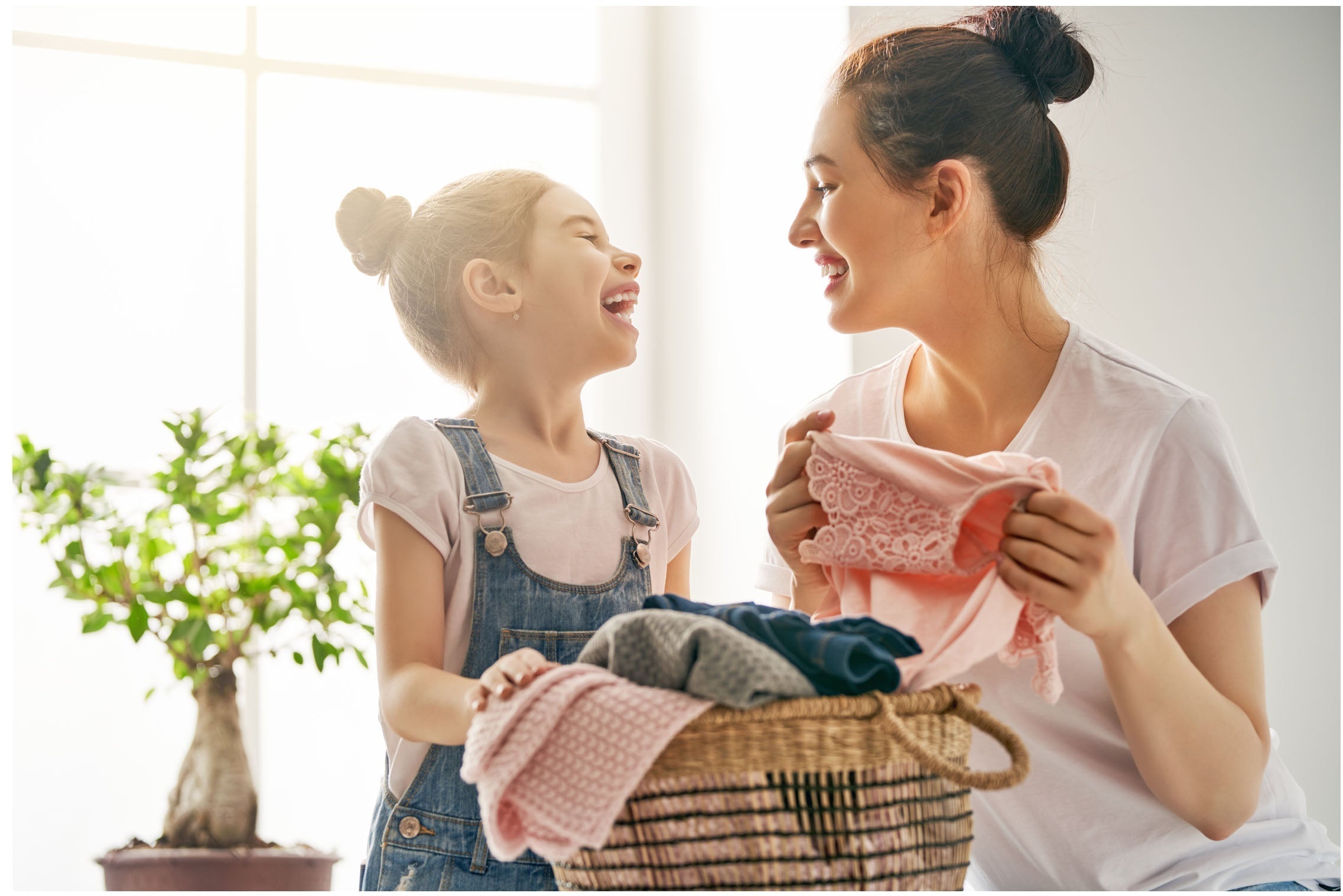 Mother and child folding laundry